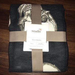 Studio 3B Halloween Skull Throw Blanket in Jet Set/Coconut Milk Factory Wrapped